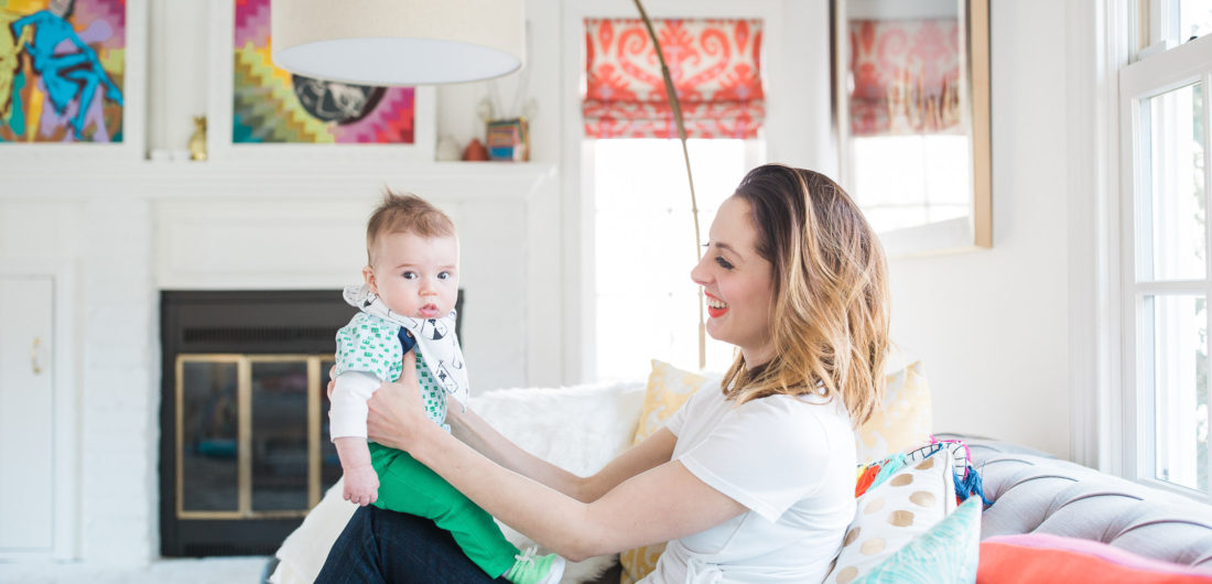 Eva Amurri Martino holds her infant son, Major, on her knee in the colorful family room of her Connecticut home
