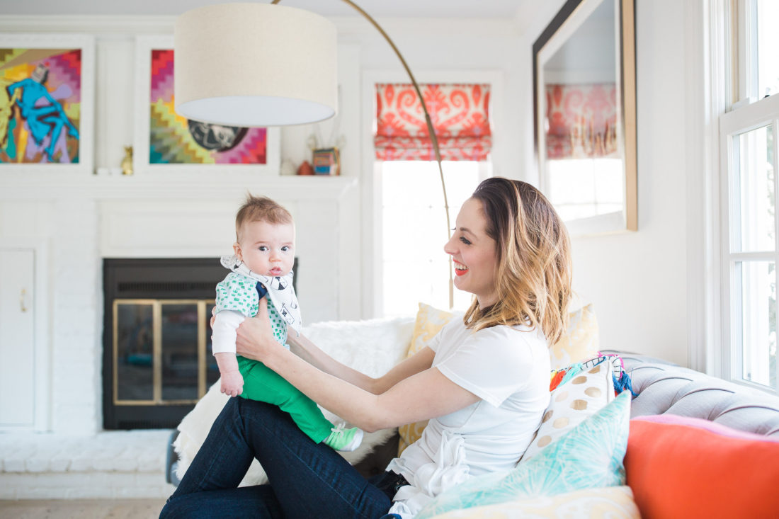 Eva Amurri Martino holds her infant son, Major, on her knee in the colorful family room of her Connecticut home