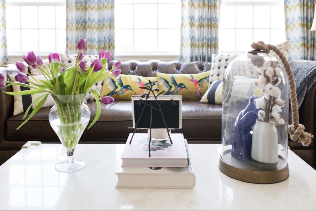 The coffee table and leather couch in the formal living room of Eva Amurri Martino's connecticut home