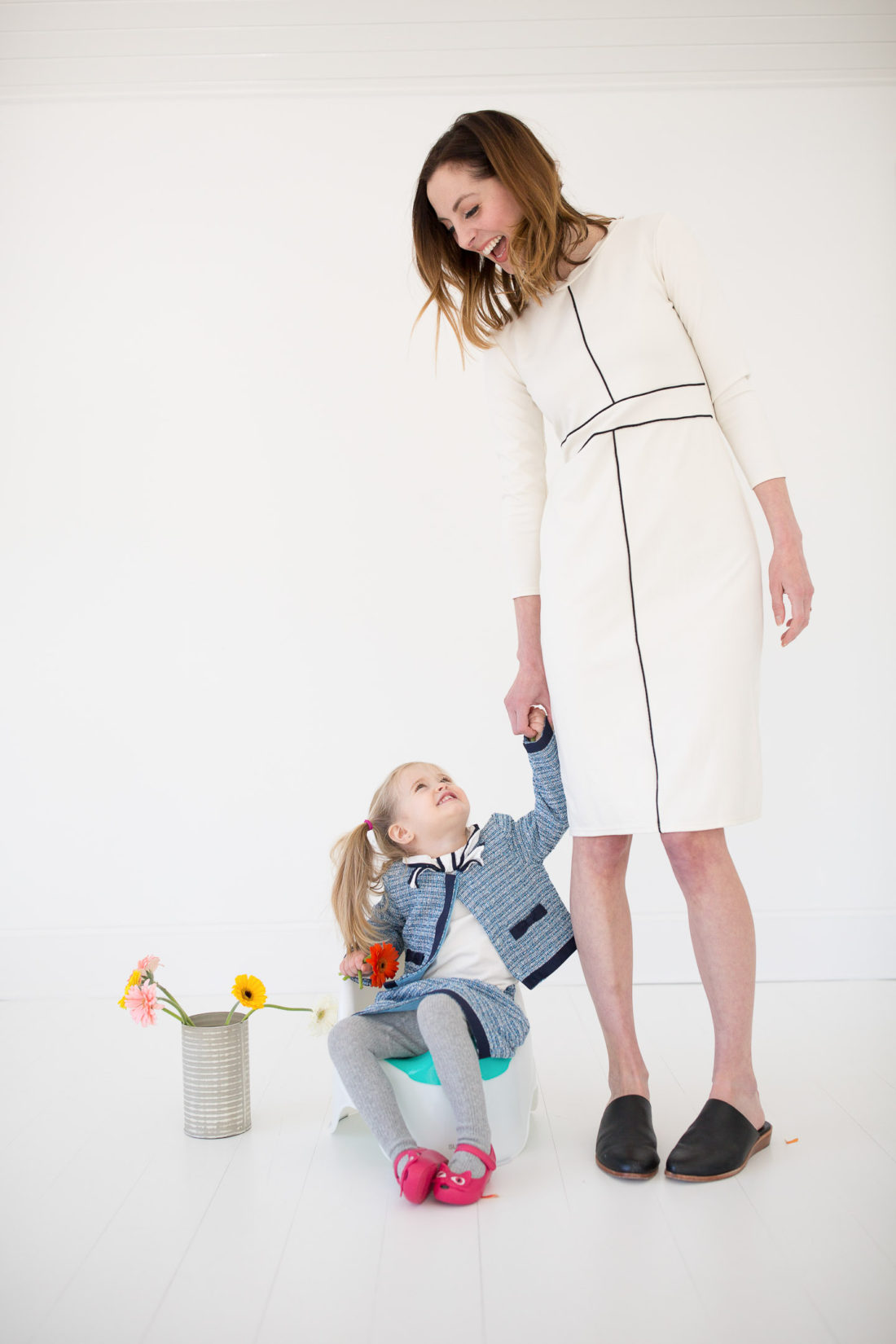 Eva Amurri Martino holds daughter Marlowe's hand while she uses the potty