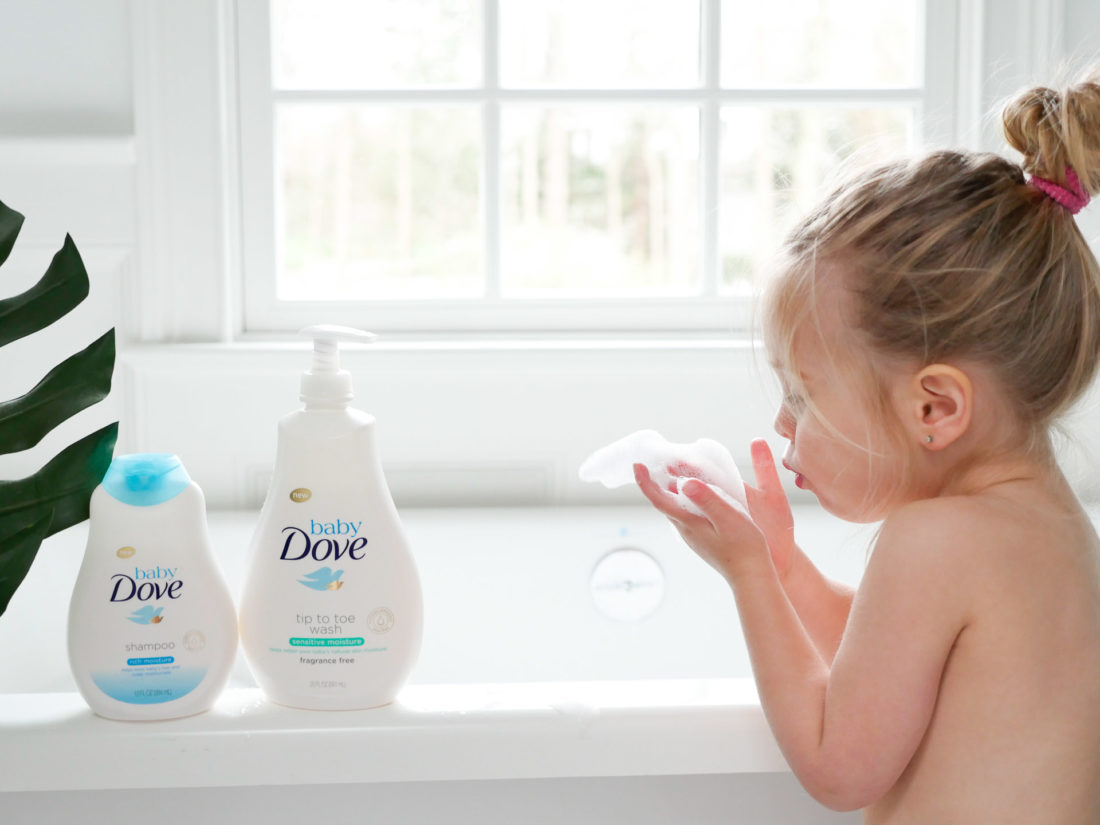 Marlowe Martino blows bath bubbles in her hands