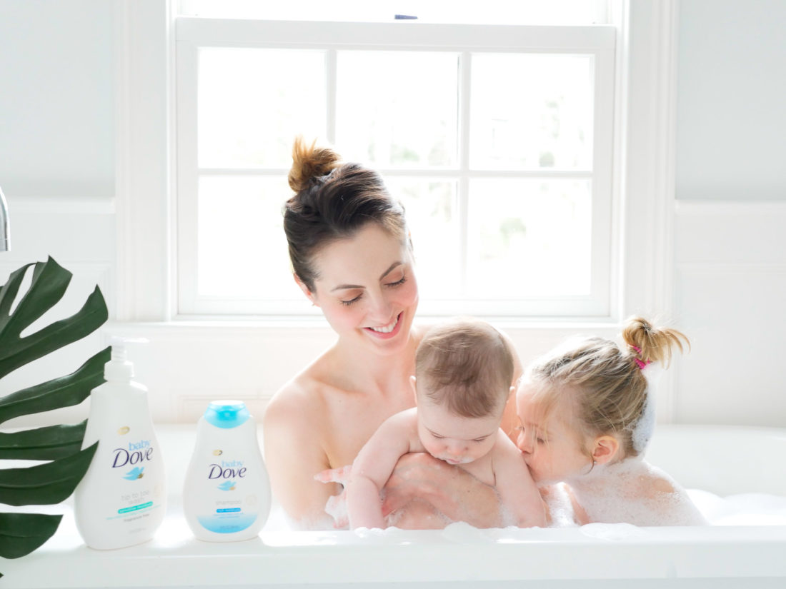 Marlowe Martino gives her baby brother a kiss in the tub