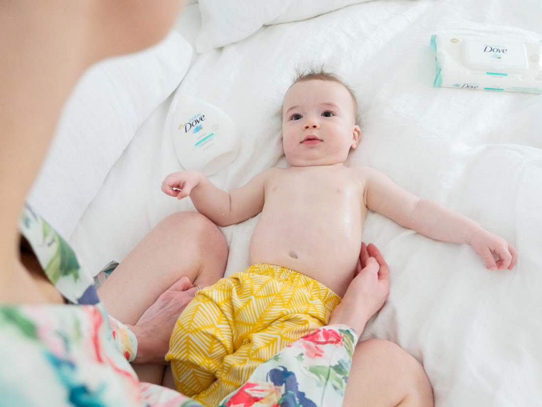 Eva Amurri Martino applies moisture lotion to the sensitive skin of her six month old son, Major