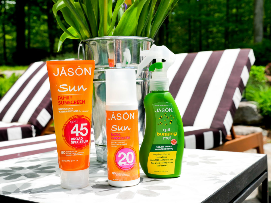 JASON sunblock and bug spray are displayed on the mosaic table beside Eva Amurri Martino's striped pool chairs