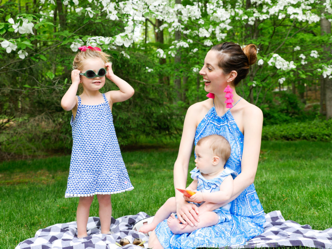 Eva Amurri Martino laughs on a picnic basket with her children, as Marlowe tries on a pair of sunglasses