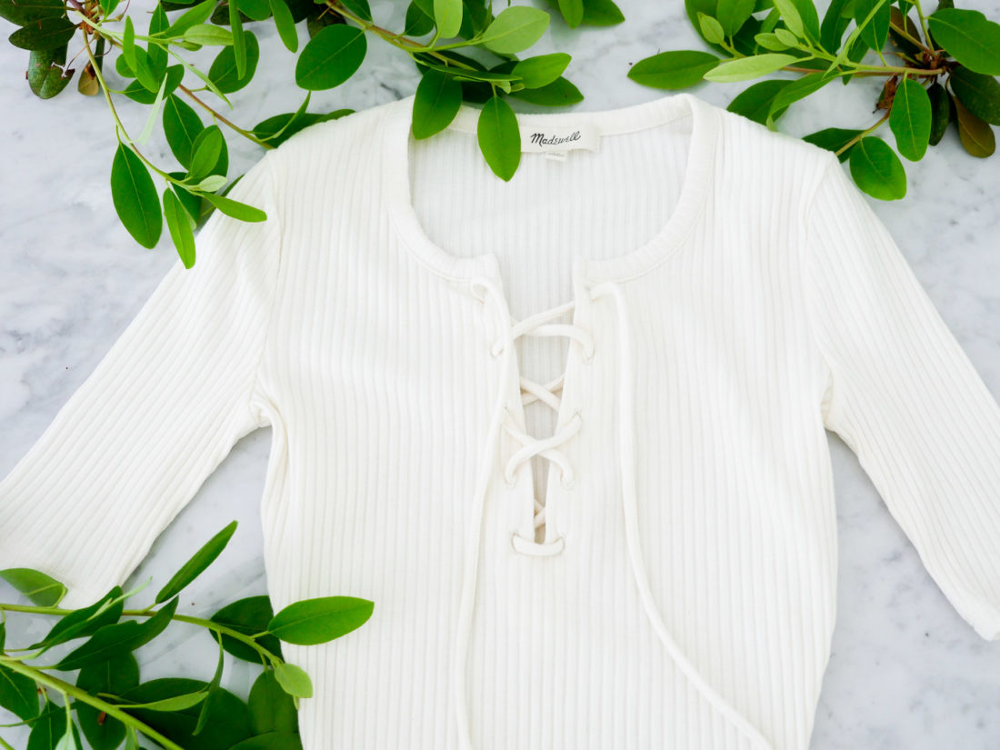 Eva Amurri Martino features a Madewell lace up off-white bodysuit as part of her monthly obsessions roundup