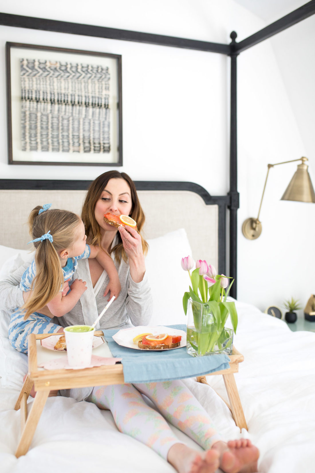 Eva Amurri Martino bites in to Smoked Salmon toast as part of a Mother's Day breakfast in bed