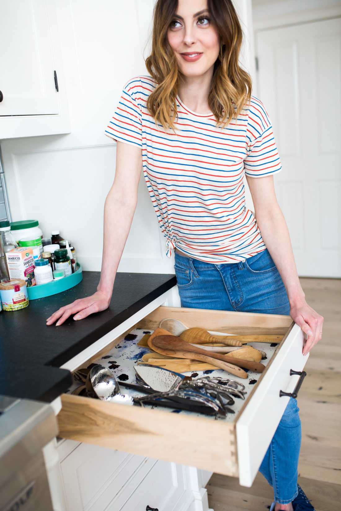 Eva Amurri Martino gives her serving drawer a bit of life with leftover wallpaper