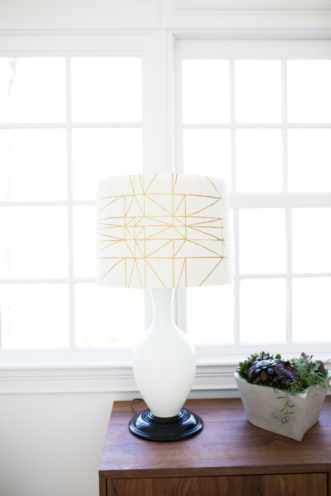 A lampshade is transformed with wallpaper