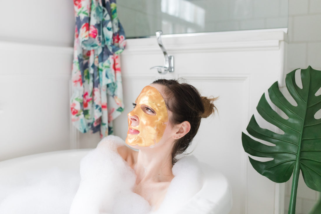 Eva Amurri Martino relaxes in the bath with a gold sheet mask on her face