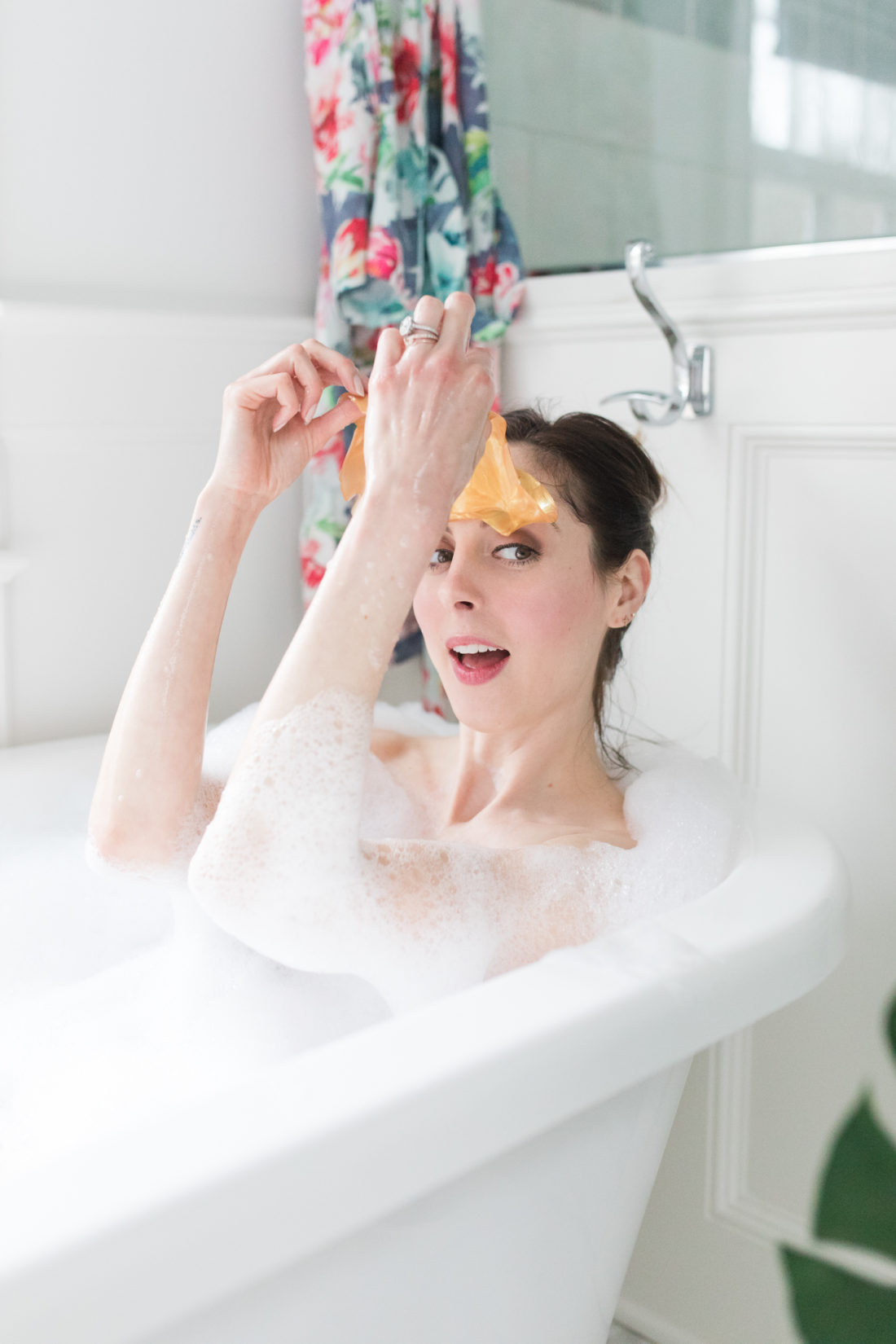 Eva Amurri Martino takes a bubble bath and peeks out from under a 24 karat gold sheet mask