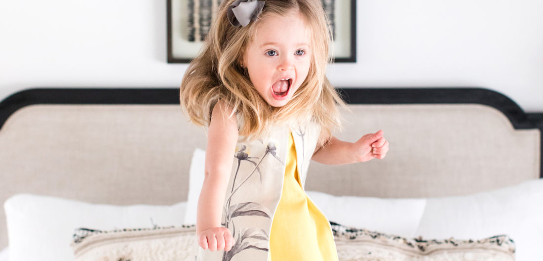 Marlowe Martino jumps happily on her mother's bed