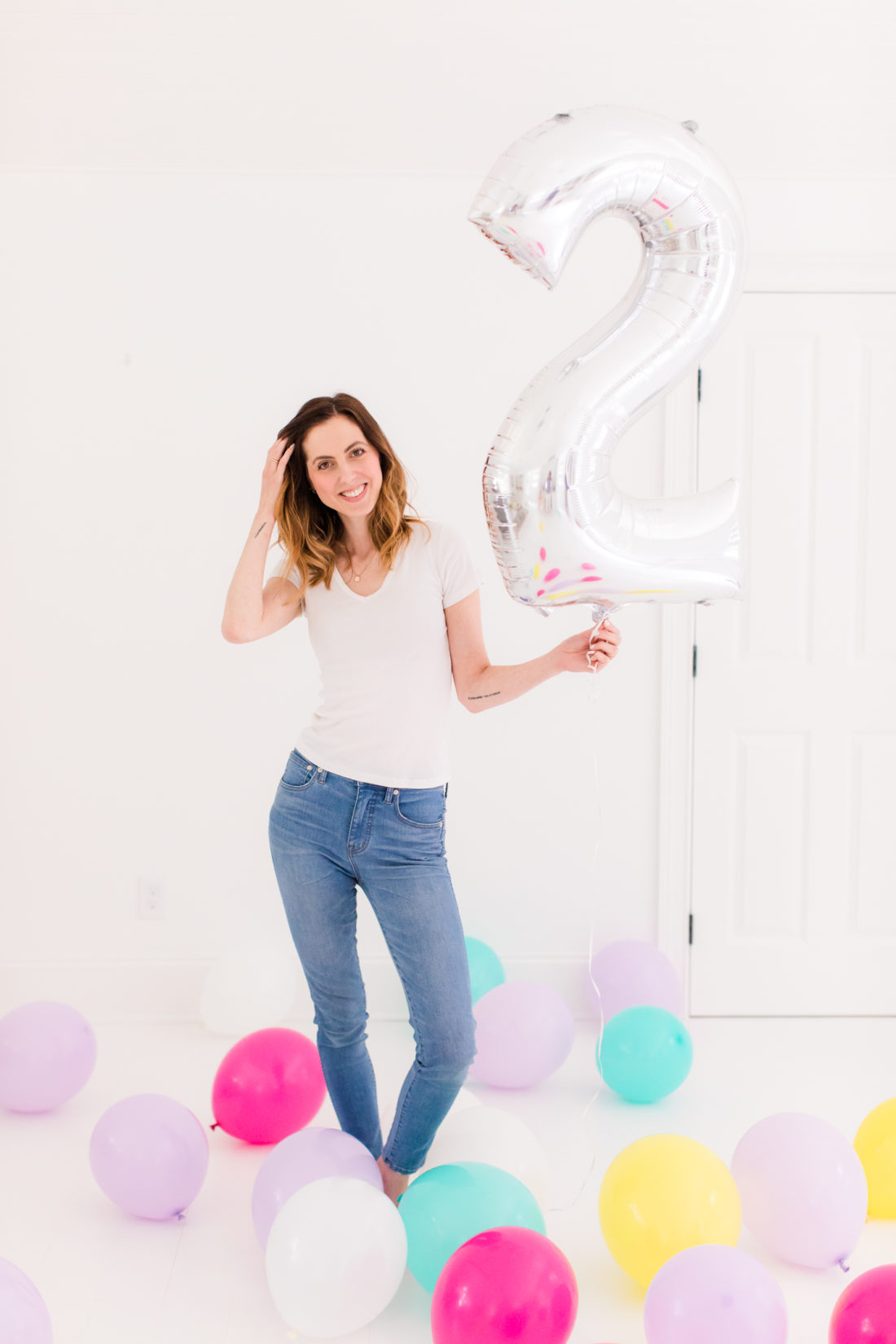 Eva Amurri Martino stands in the Happily Eva After studio filled with balloons to celebrate the second anniversary of the blog