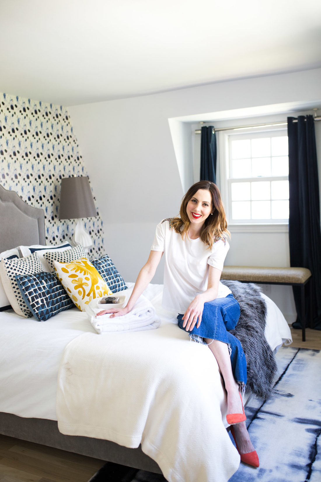 Eva Amurri Martino lounges on the bed in her newly revamped Guest Room in Connecticut