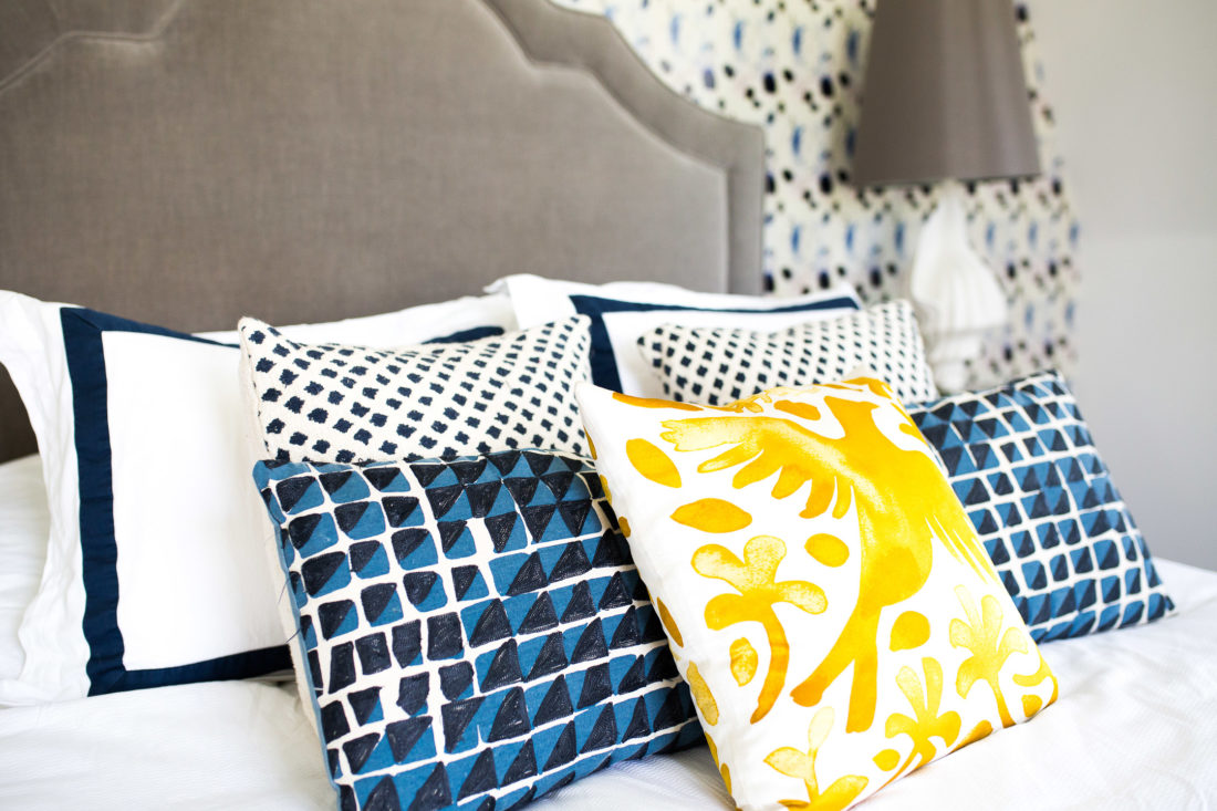 A fun mix of patterned pillows in a blue and white color scheme