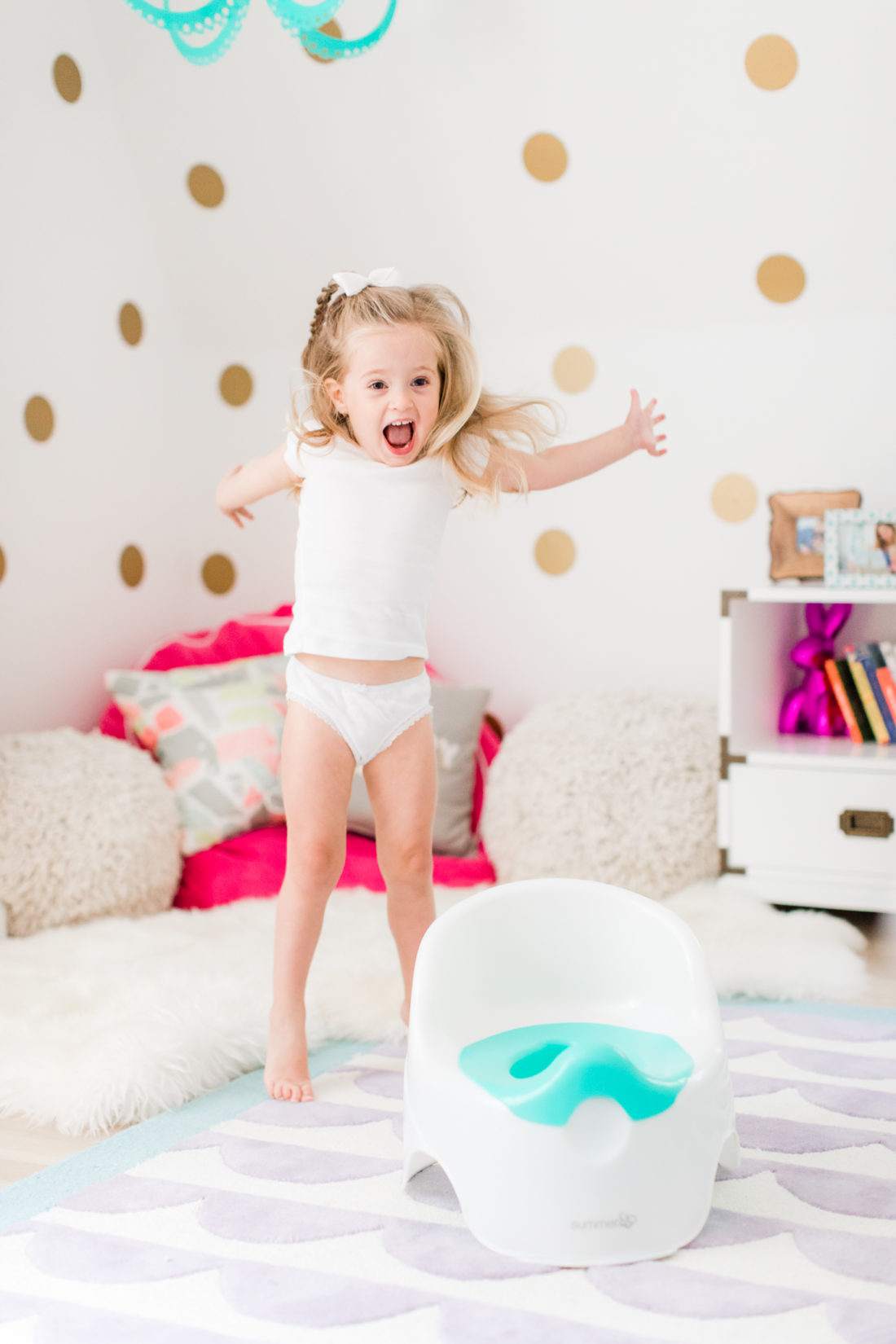 Marlowe Martino jumps for joy to be finished with potty training!