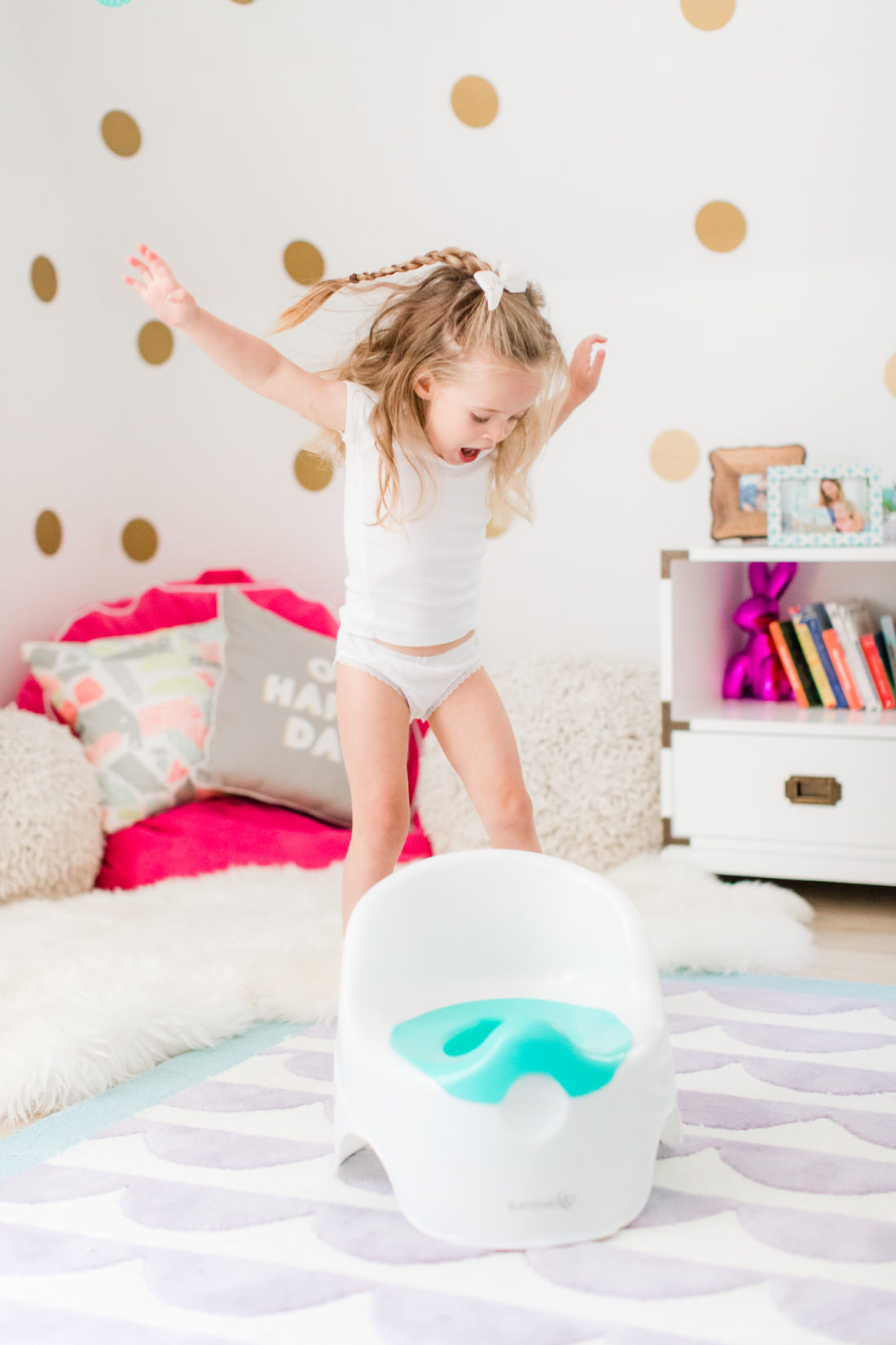 Marlowe Martino jumps for joy with her potty chair