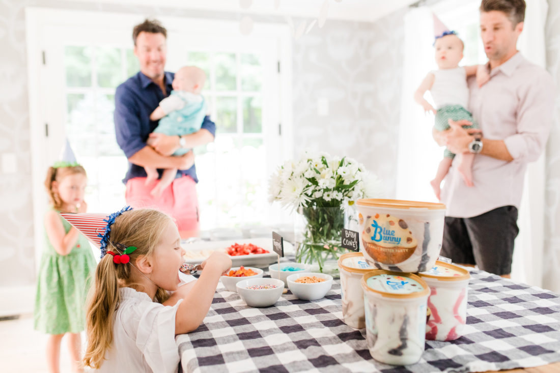 Marlowe Martino takes a spoonful of sprinkles at the festive ice cream social at her Connecticut home