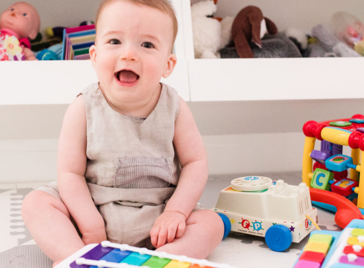 Eight month old Major Martino sits among his colorful toys at home in Connecticut