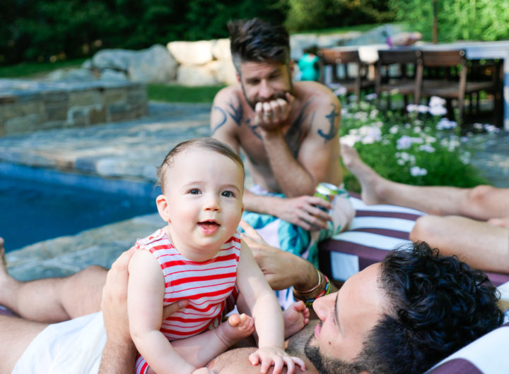 Major Martino hangs out with a group of men, including father Kyle Martino beside the pool at their Connecticut home