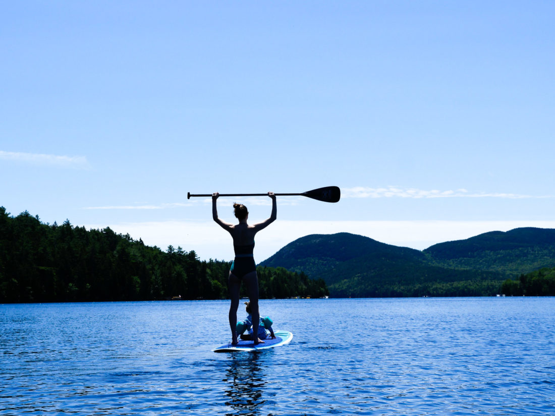 Eva Amurri Martino paddles out on the lake with Marlowe on her paddle board