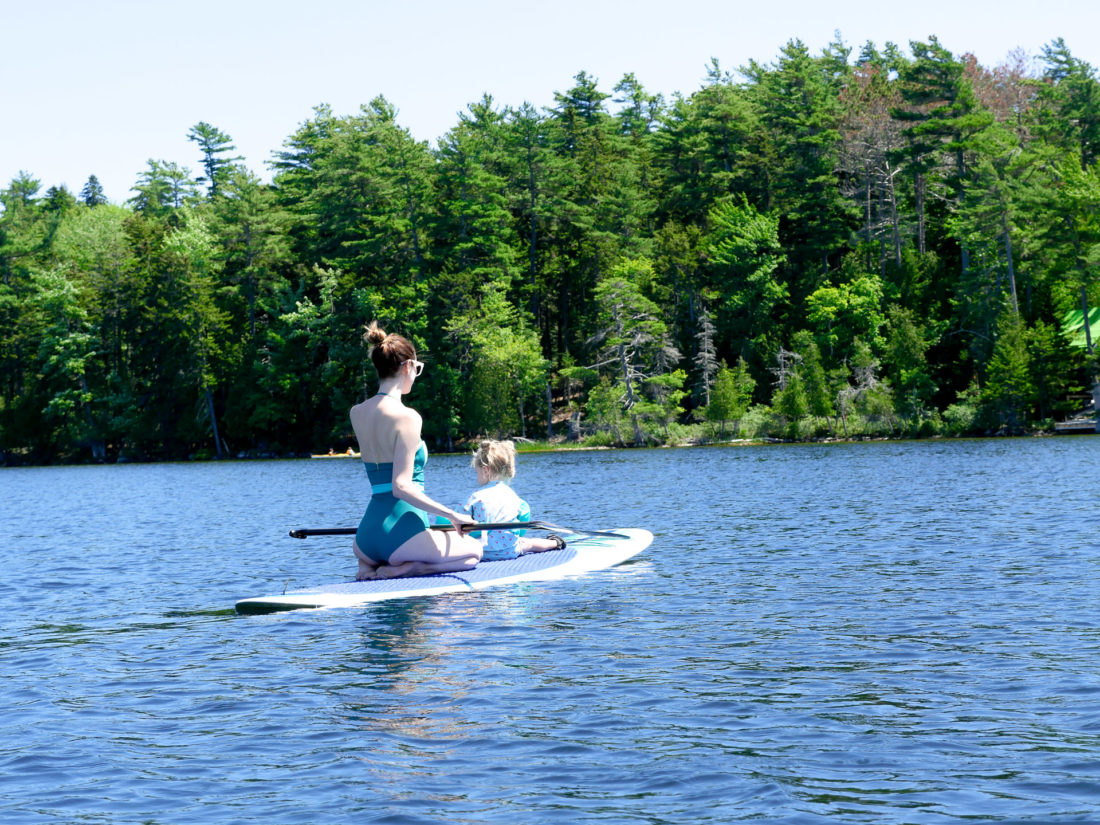 Eva Amurri Martino paddles out on the lake with Marlowe on her paddle board