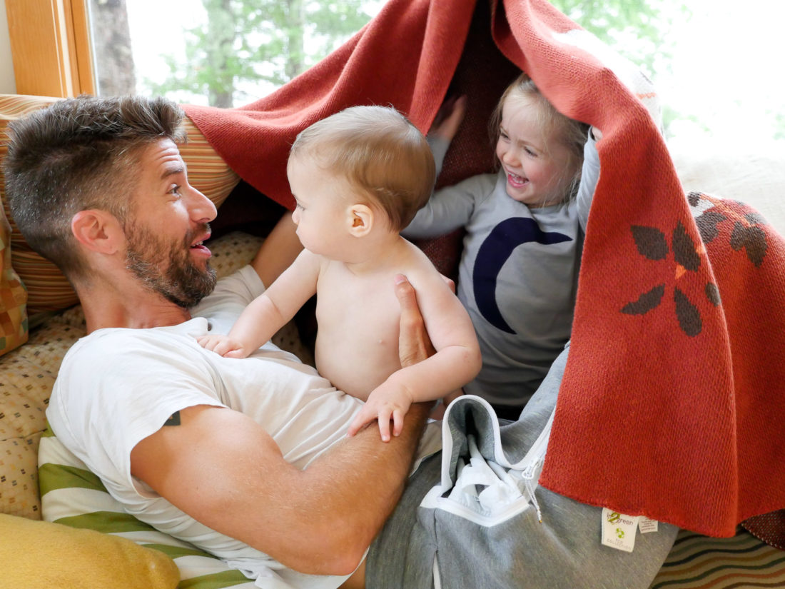 Kyle Martino horses around with his two small children Marlowe and Major at their lake house in Maine