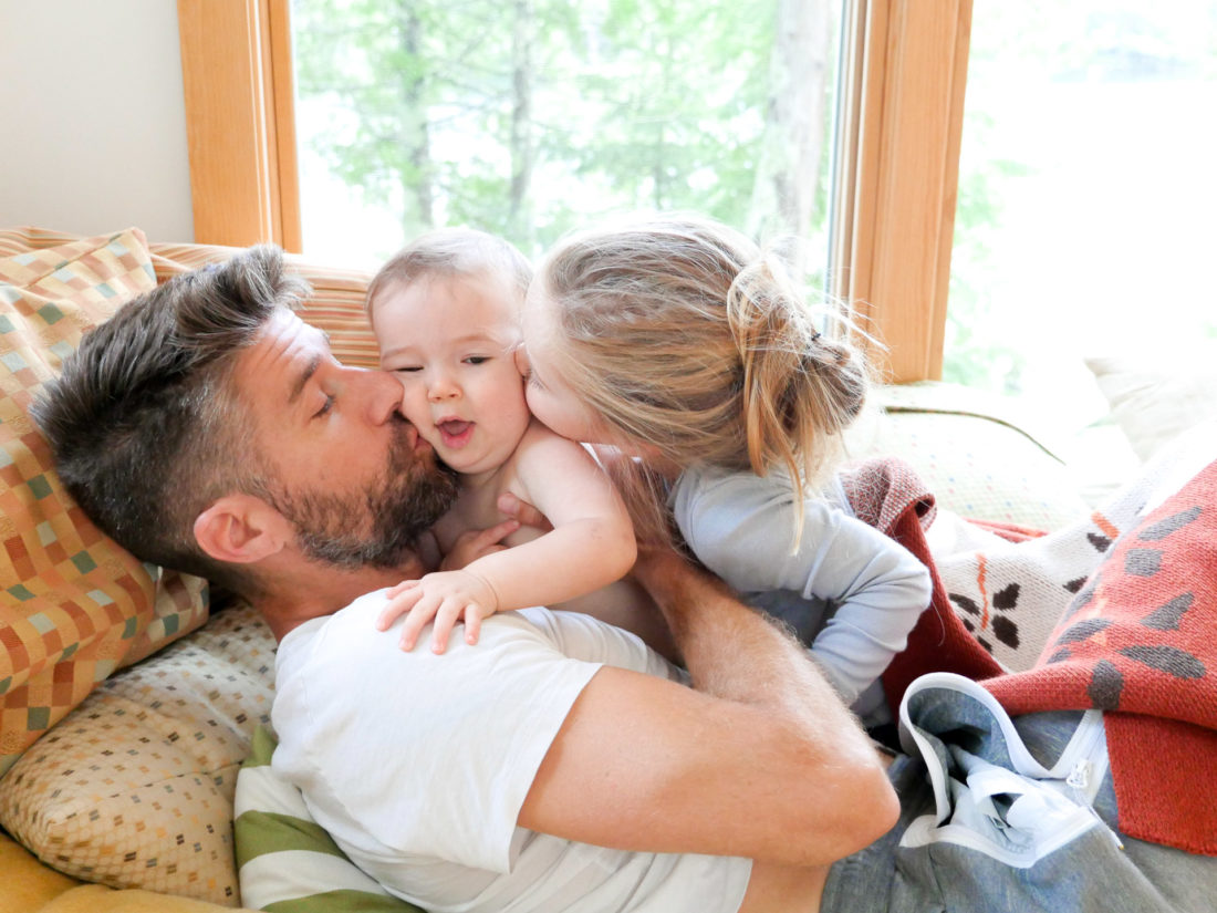 Kyle Martino horses around with his two small children Marlowe and Major at their lake house in Maine