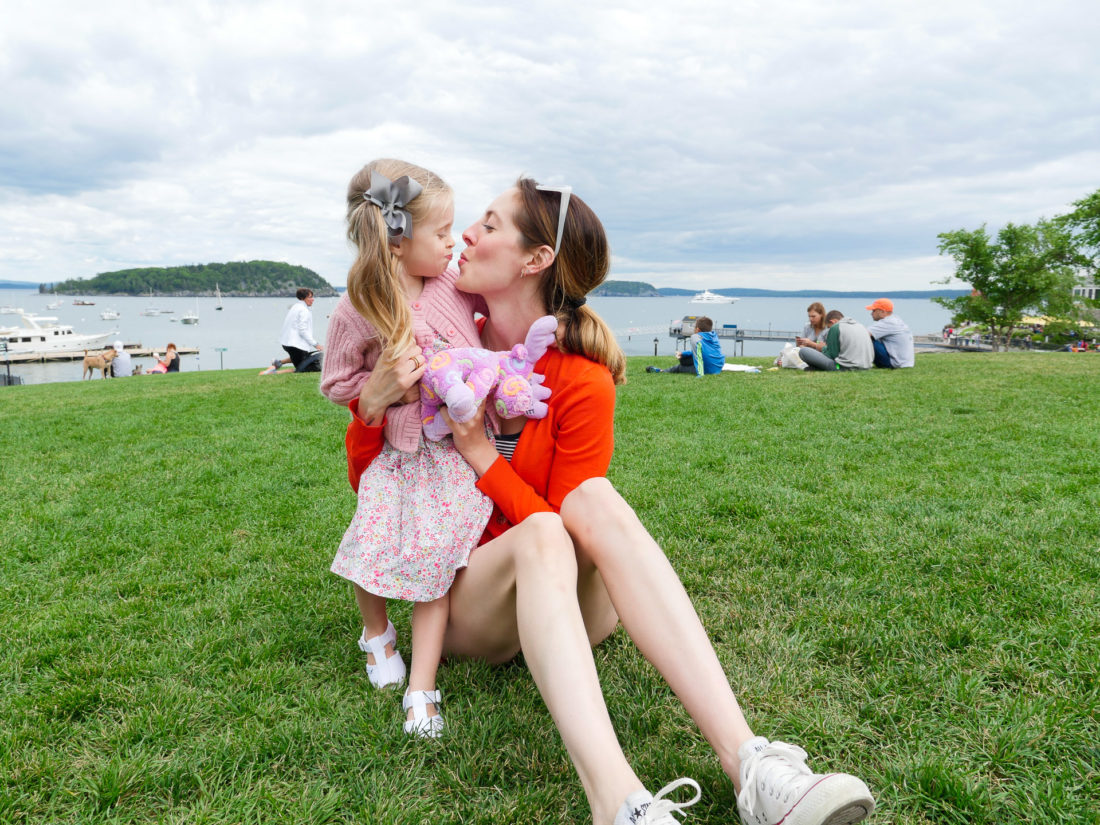 Eva Amurri Martino leans in for a kiss with two year old daughter, Marlowe, on the green in downtown Bar Harbor, ME