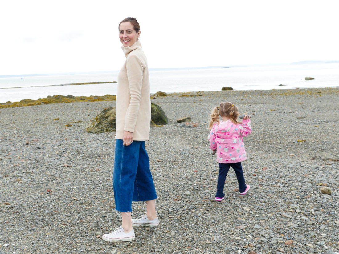 Eva Amurri Martino walks on a pebble beach with daughter Marlowe in the Bar Harbor Area of Maine