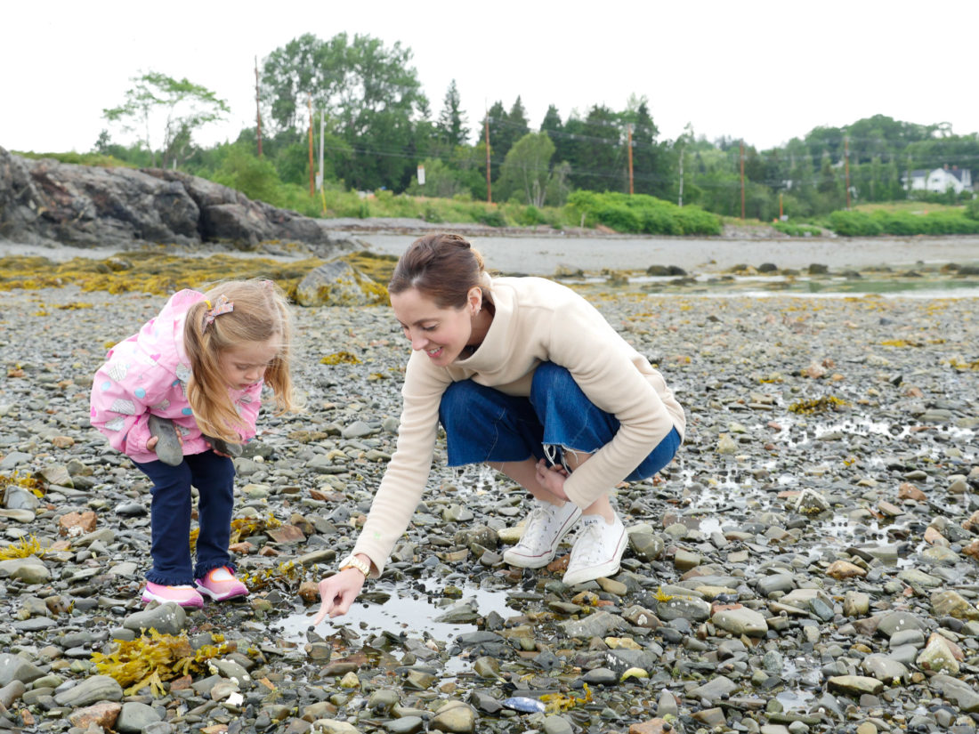 Eva Amurri Martino explores tidal pools with two year old daughter Marlowe on the beach in Maine
