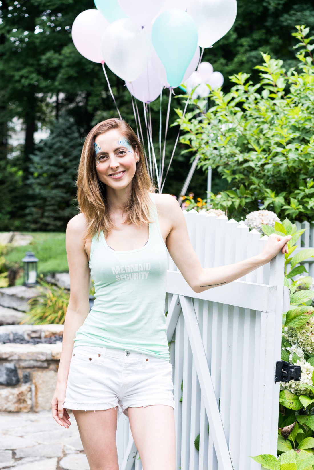 Eva Amurri Martino wears a Mermaid Sercurity tank designed using the Happily App and greets guests at her daughter's third birthday party