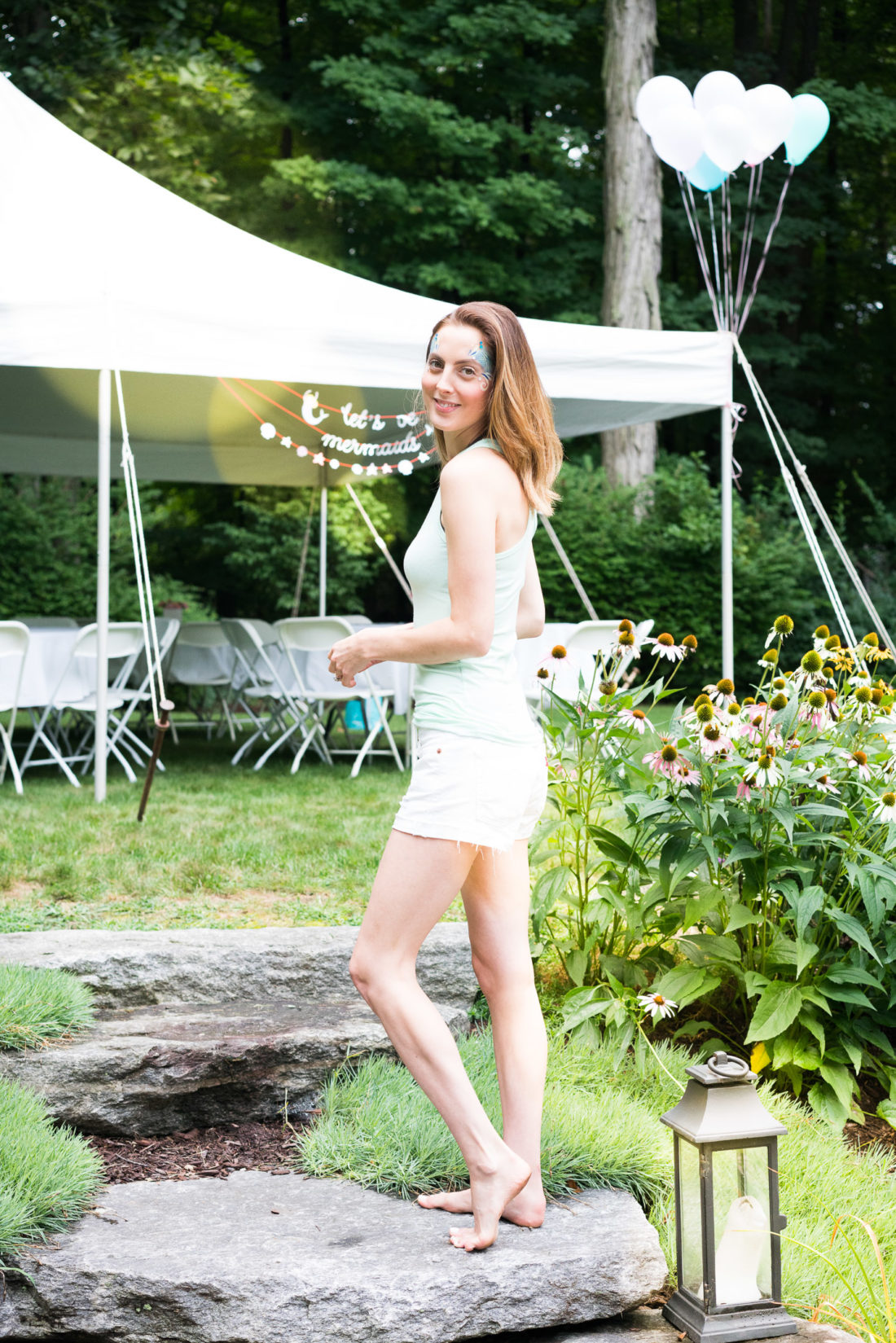 Eva Amurri Martino wears a Mermaid Sercurity tank designed using the Happily App and greets guests at her daughter's third birthday party