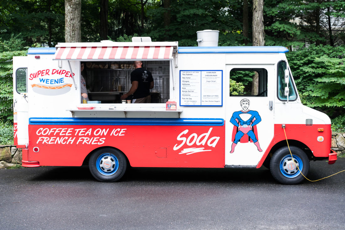 Guests enjoy a hot dog truck at Marlowe Martino's third birthday party