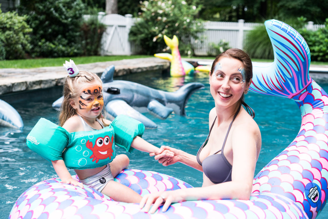 Marlowe Martino gets her face painted like a tiger at her third birthday party