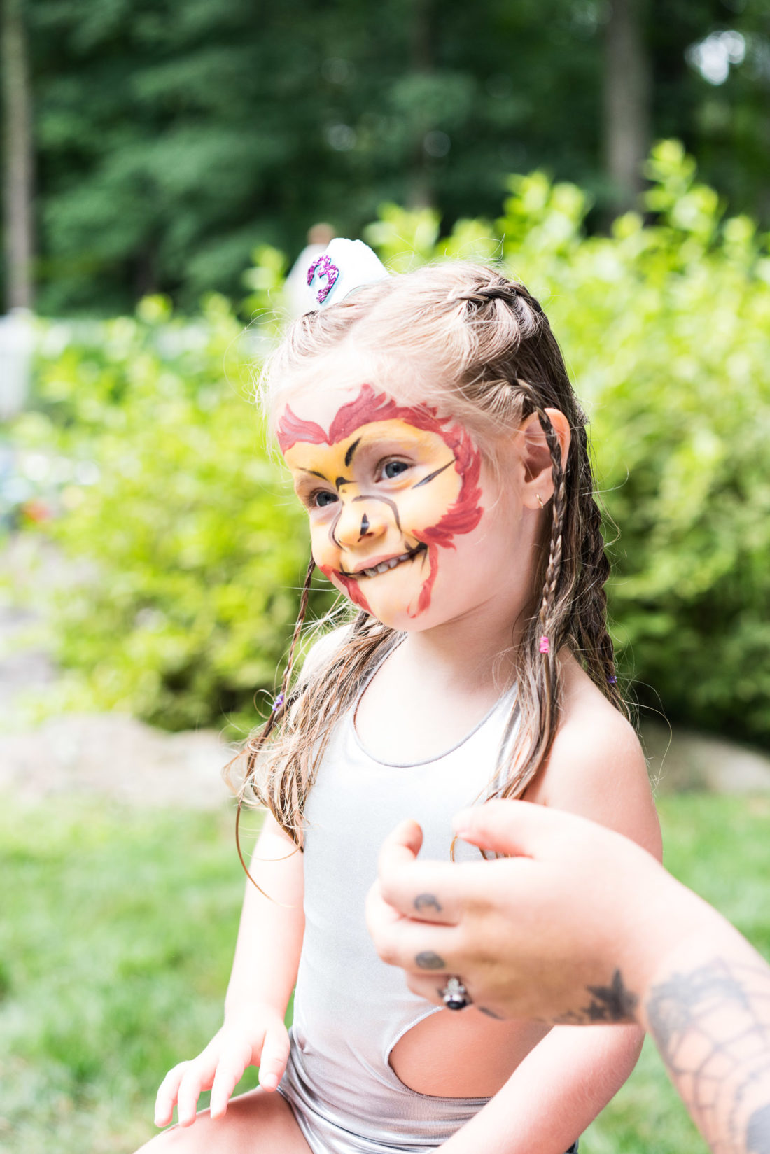 Marlowe Martino gets her face painted for a second time at her third birthday party