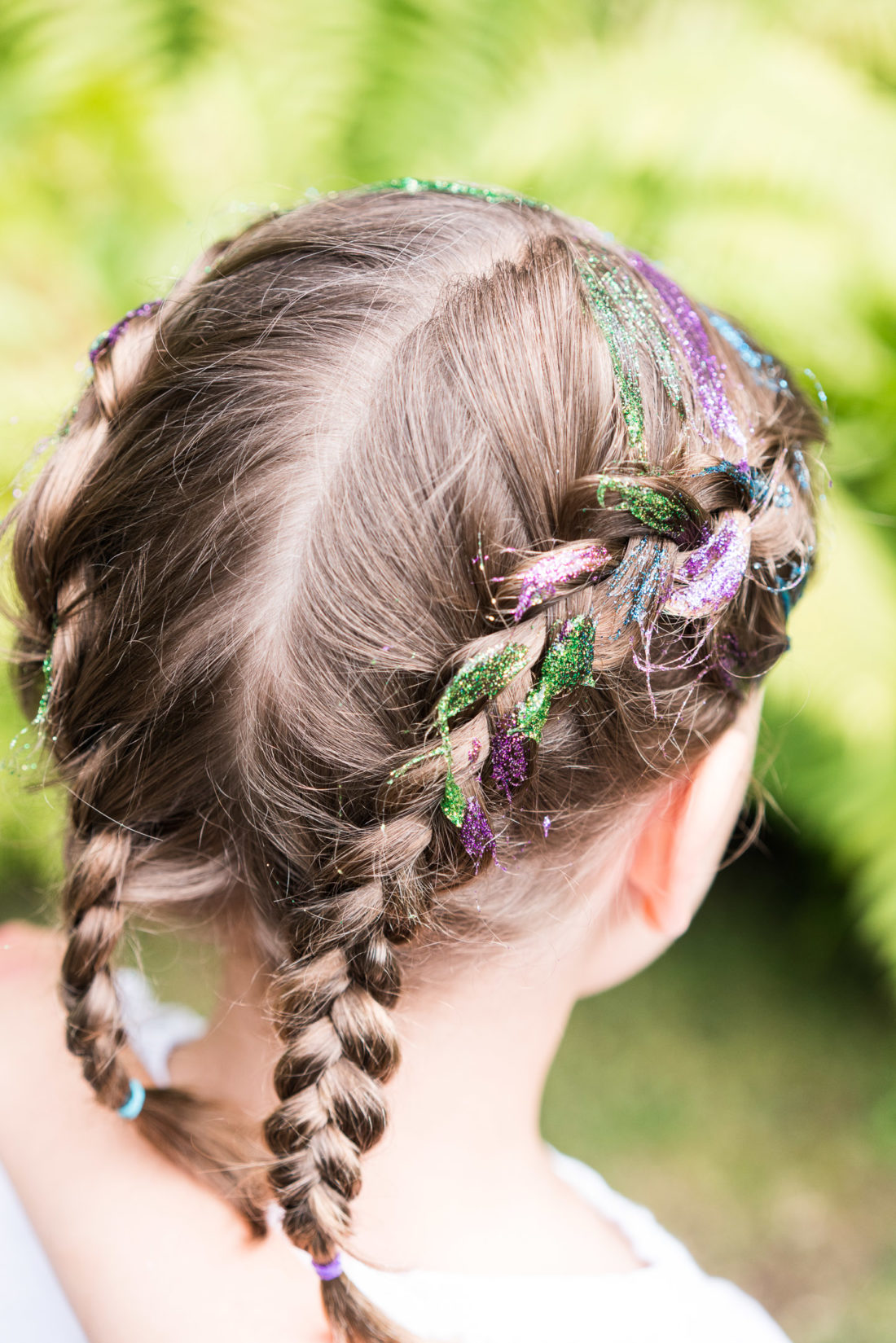 Marlowe Martino gets her face painted like a tiger at her third birthday party