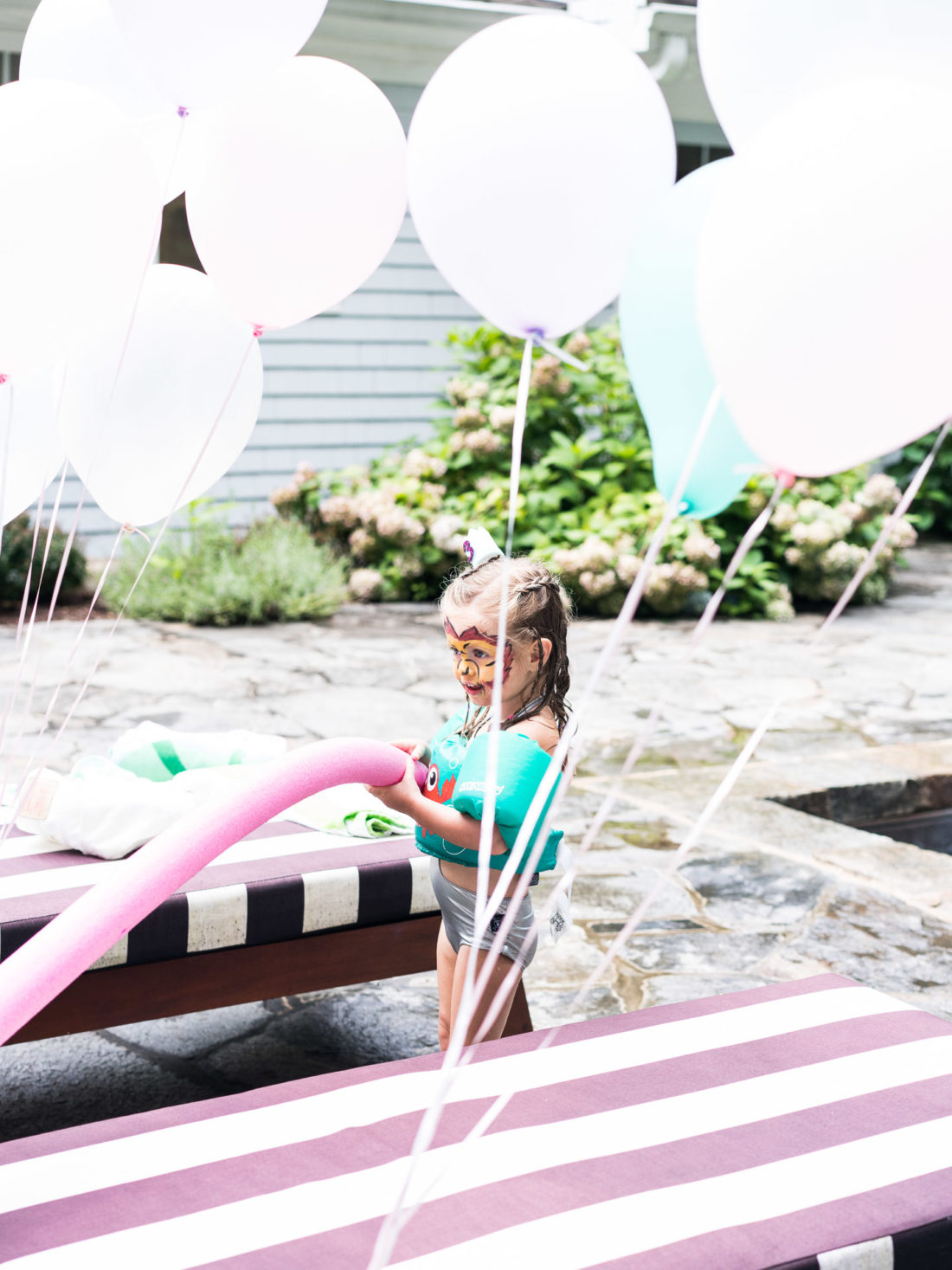 Marlowe Martino plays by the pool at her third birthday party