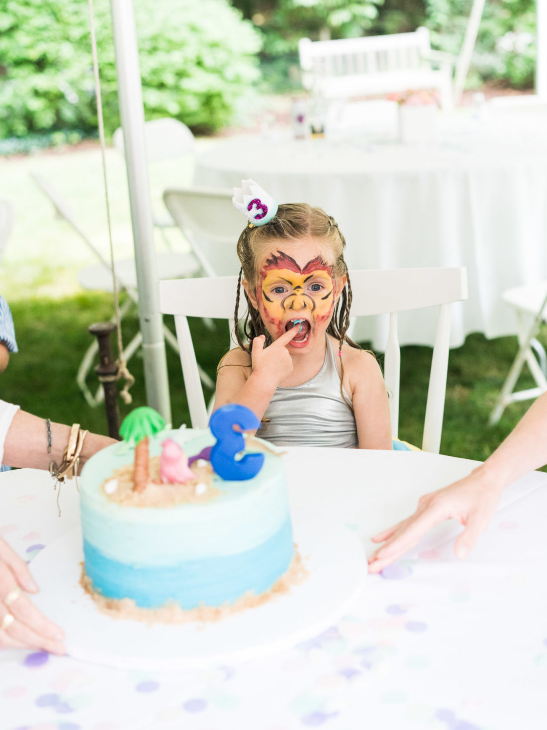 Marlowe Martino tastes the cake at her third birthday party