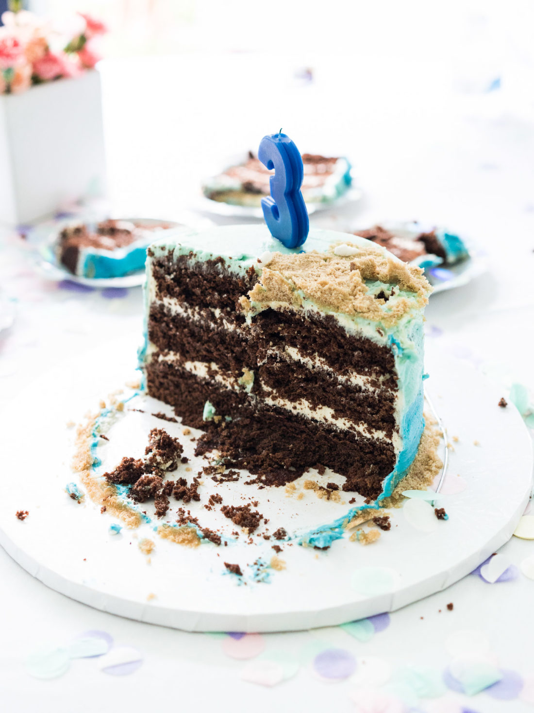 A half eaten chocolate cake at Marlowe Martino's third birthday party