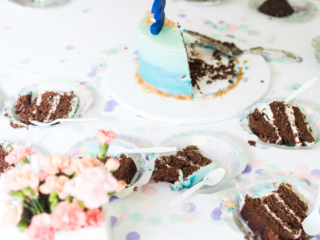 Guests enjoy the chocolate birthday cake at Marlowe Martino's third birthday party