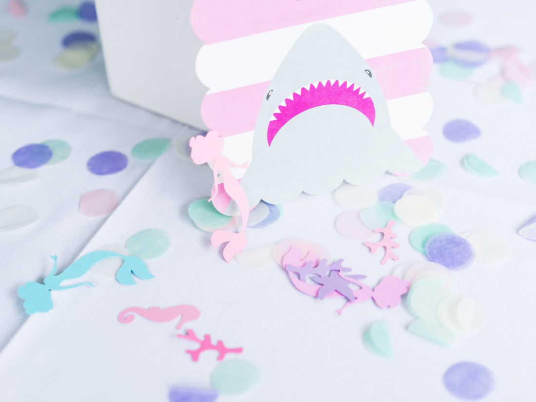 The pink and white shark invitation to Marlowe Martino's third birthday party