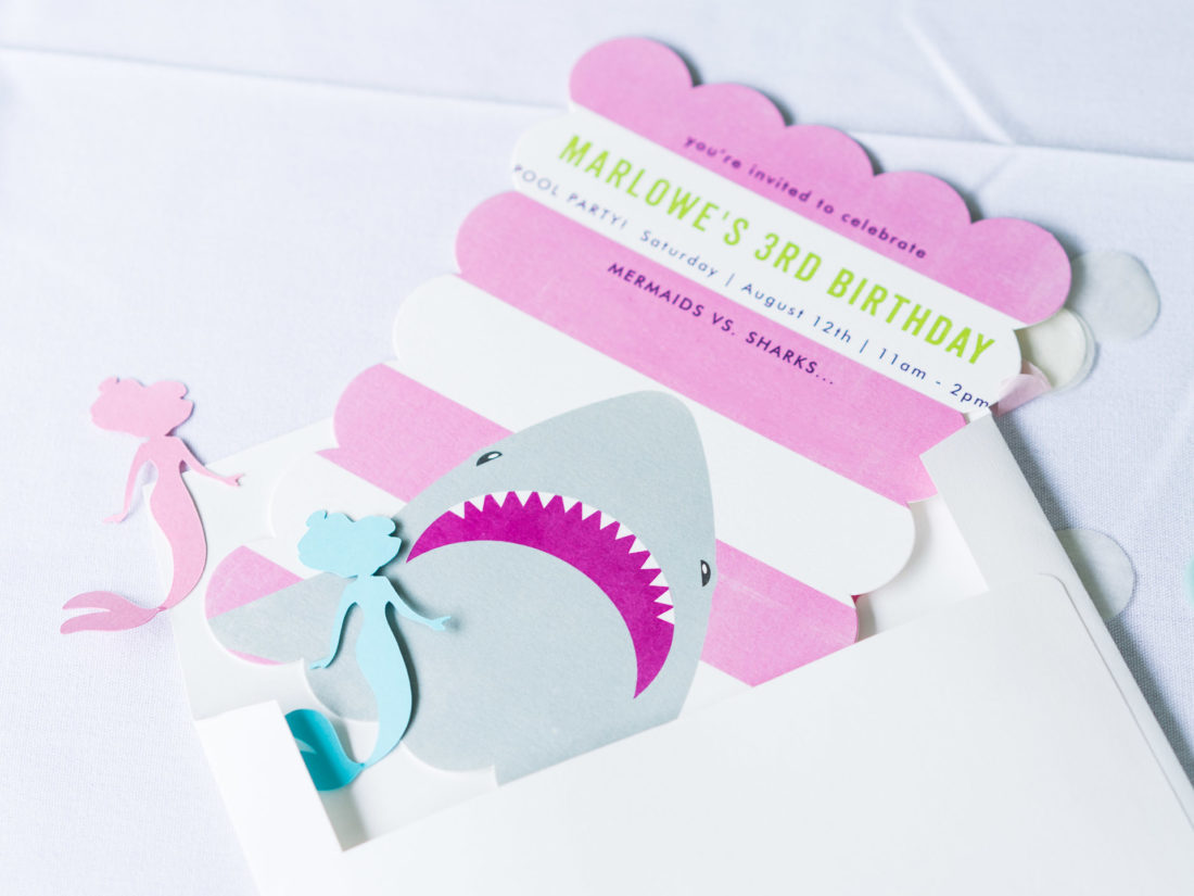 The pink and white shark invitation to Marlowe Martino's third birthday party