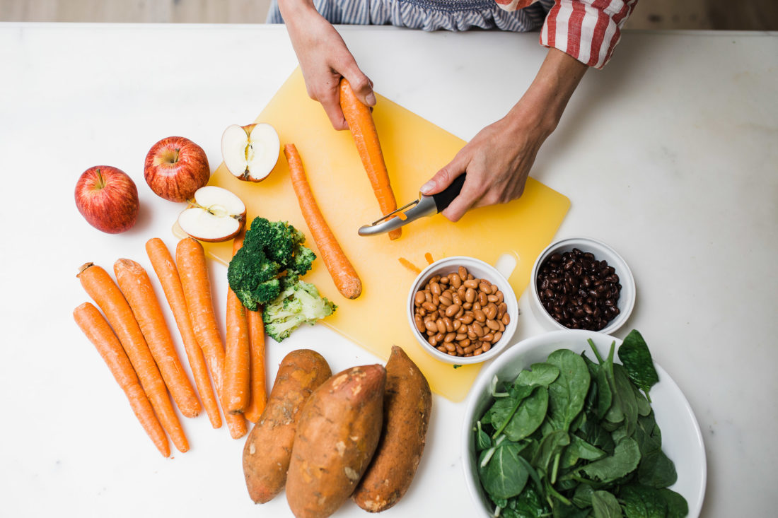 Eva Amurri Martino preps fresh organic fruits and vegetables to make homemade baby food in the kitchen of her Connecticut home