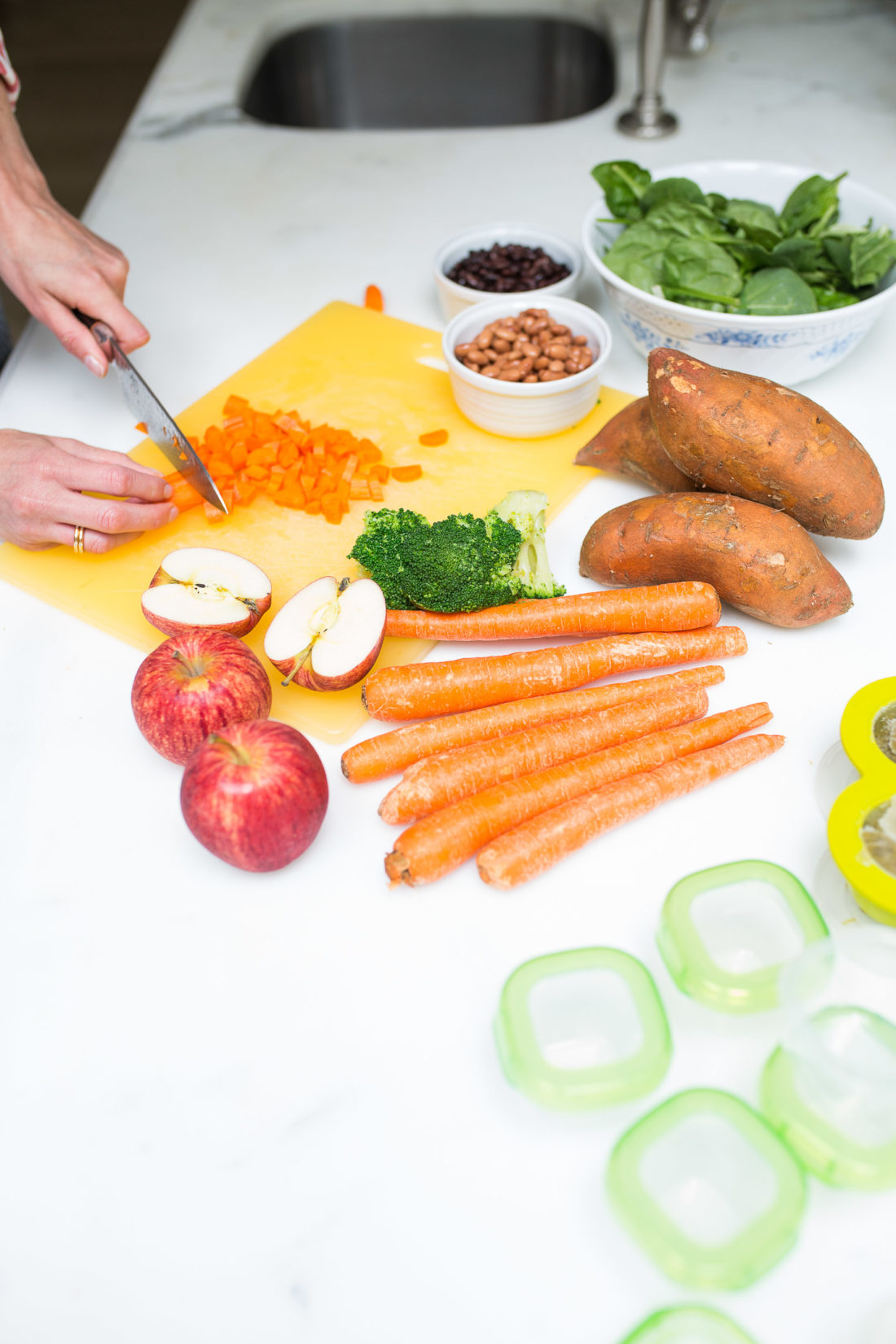 Eva Amurri Martino preps fresh organic fruits and vegetables to make homemade baby food in the kitchen of her Connecticut home