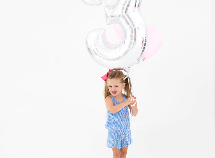 Marlowe Martino poses with a large balloon for her third birthday portraits