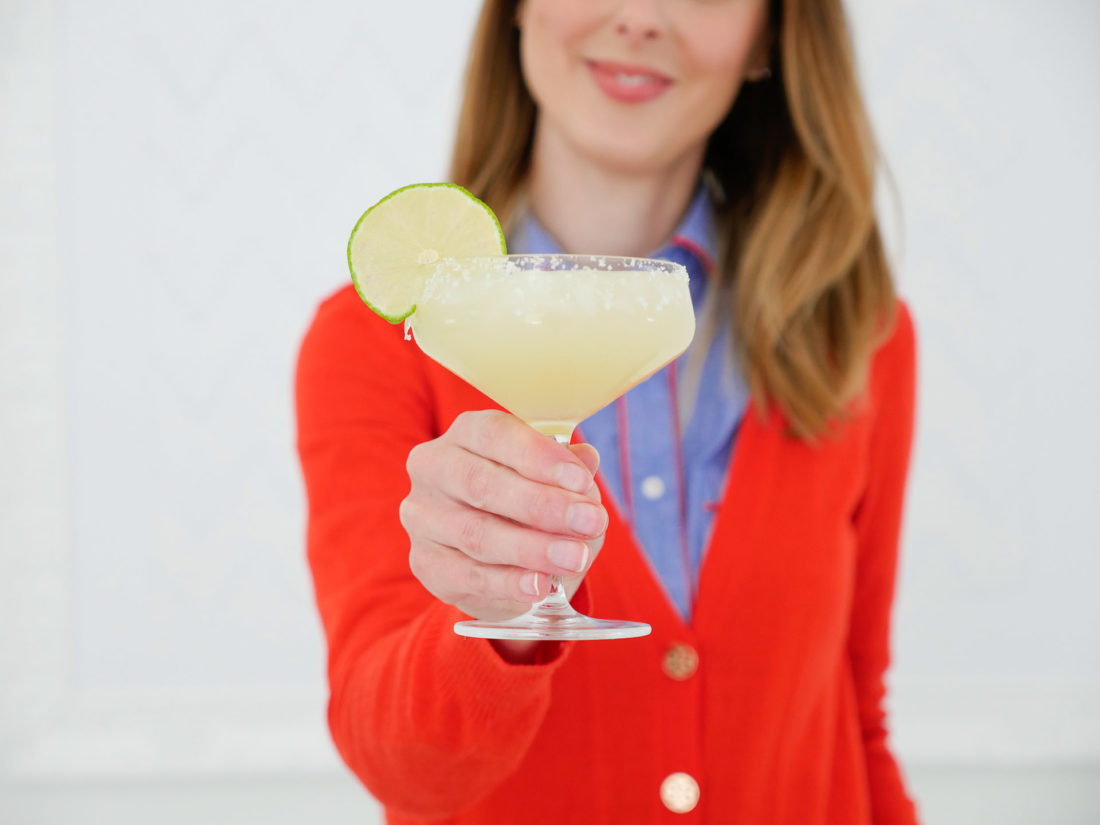 Eva Amurri Martino holds up a frosty margarita, garnished with a lime