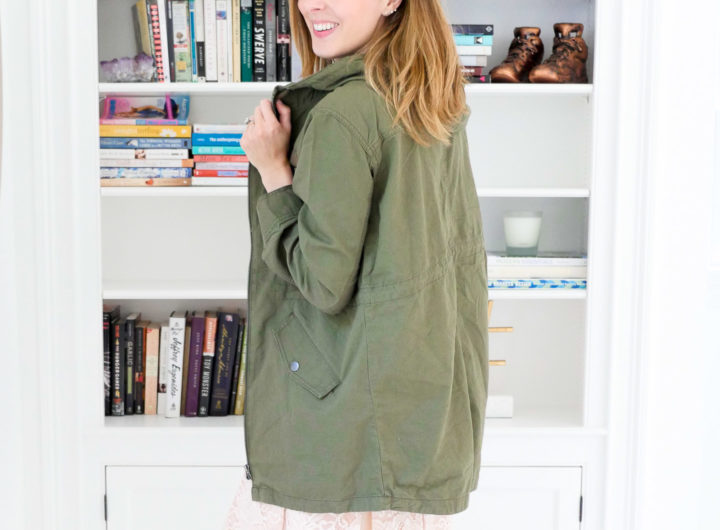 Eva Amurri Martino wears an olive green hooded anorak jacket over a black tank top