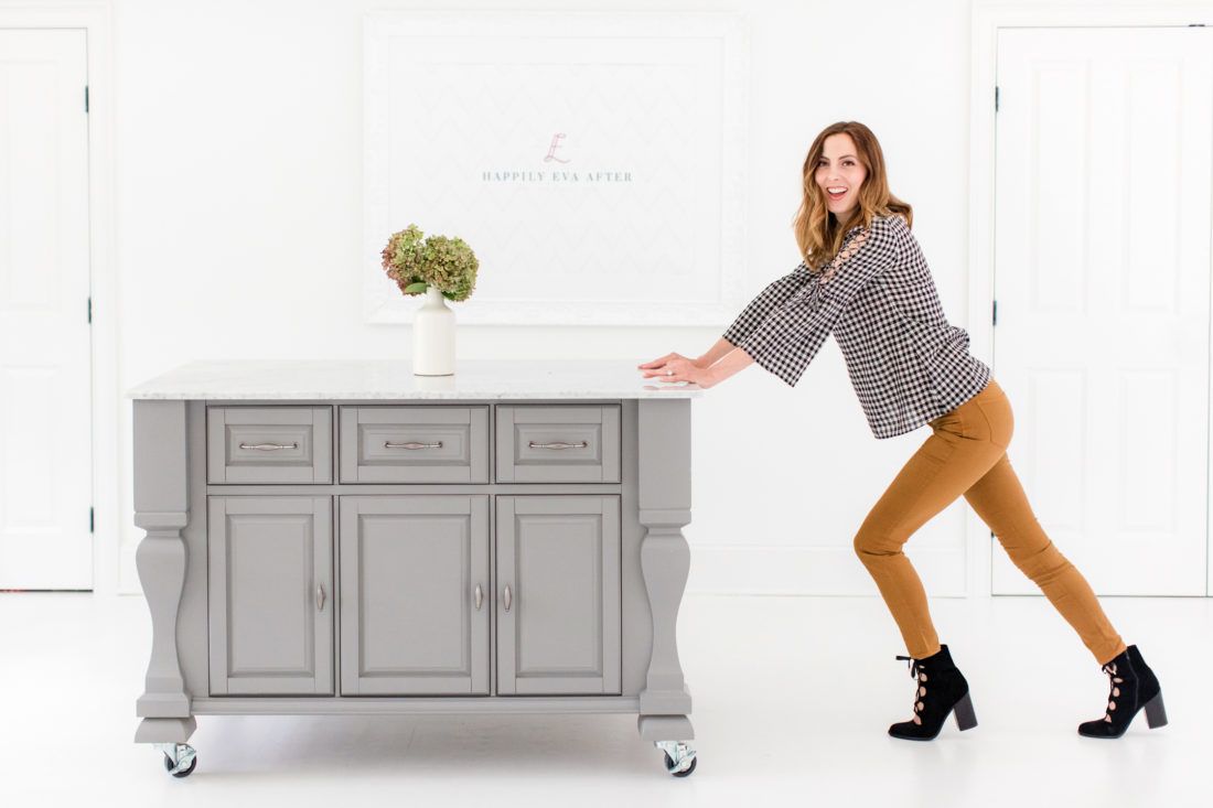 Eva Amurri Martino pushes her grey crafting island across the floor of the Happily Eva After studio