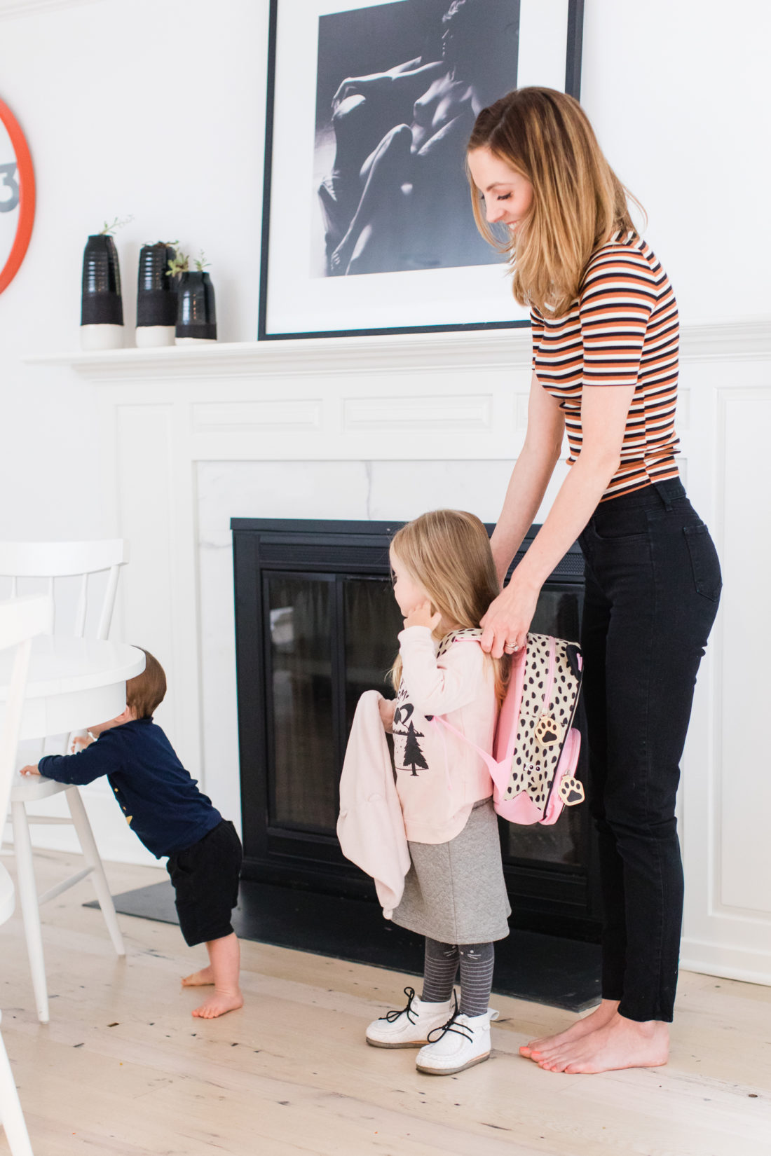 Eva Amurri Martino helps three year old daughter Marlowe to put on her backpack as they prepare for the first day of Preschool